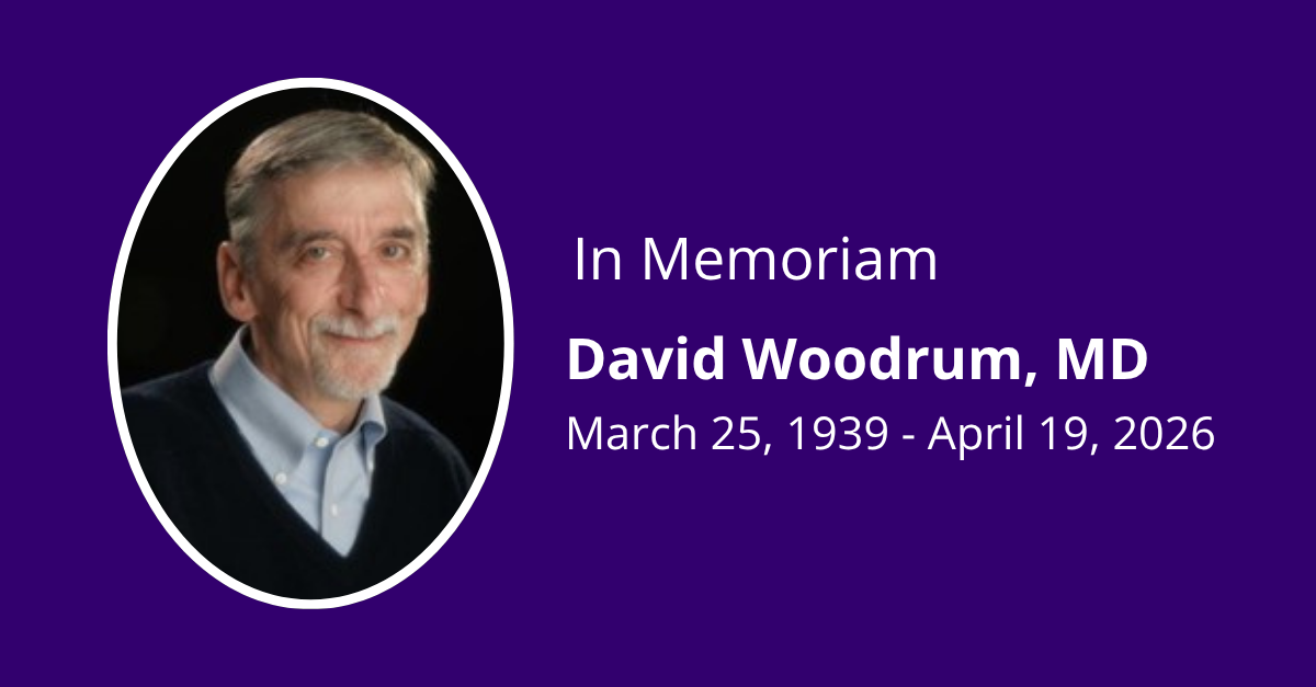 A head and shoulders photo of Dr. David Woodrum on a dark purple background, with white text that says "In Memoriam, David Woodrum, MD. March 25, 1939 - April 19, 2026."