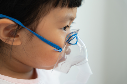 child receiving breathing treatment
